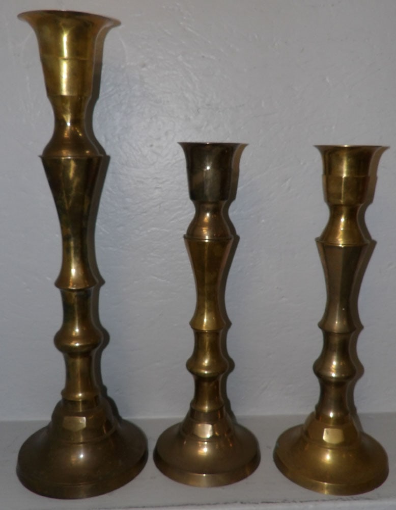 lot of 3 large candlesticks: lot of 3 large candlesticks . Up to 24" H 7 Dia. ALL DESCRIPTIONS AND ANY CONDITION STATEMENT GIVEN BY LANGSTON AUCTION GALLERY ARE STRICTLY OPINIONS AND LANGSTON'S SHALL HAVE NO RESPONSIBILITY FOR ER