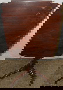 19th century mahogany tilt top tea table: 19th century mahogany tilt top tea table. 28 3/4" H 24" W 20 1/2" D ALL DESCRIPTIONS AND ANY CONDITION STATEMENT GIVEN BY LANGSTON AUCTION GALLERY ARE STRICTLY OPINIONS AND LANGSTON'S SHALL HAVE NO RE