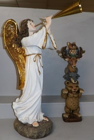 painted resin angel statue and decorative wall hanging