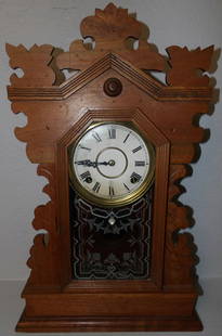 antique walnut kitchen clock by gilbert clock company: antique walnut kitchen clock by gilbert clock company . 22 1/4" H 14" W 4 1/4" D ALL DESCRIPTIONS AND ANY CONDITION STATEMENT GIVEN BY LANGSTON AUCTION GALLERY ARE STRICTLY OPINIONS AND LANGSTON'S SHA