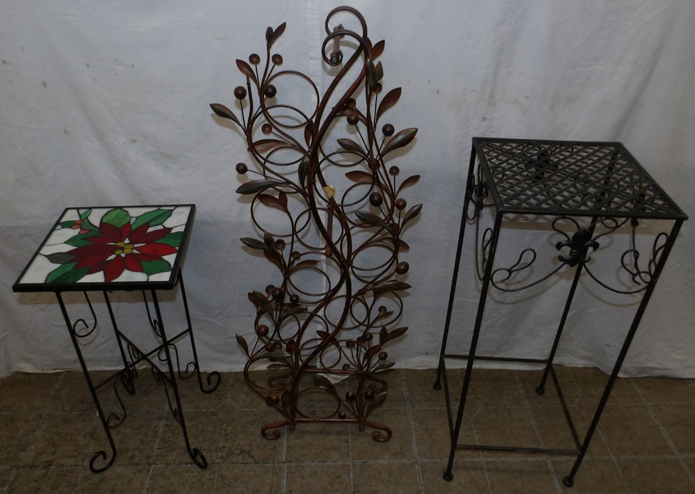 Two Painted Metal Plant Stands & Metal Wine Rack: Two Painted Metal Plant Stands & Metal Wine Rack . Up to 27 1/4" H 11" Dia. ALL DESCRIPTIONS AND ANY CONDITION STATEMENT GIVEN BY LANGSTON AUCTION GALLERY ARE STRICTLY OPINIONS AND LANGSTON'S SHALL HA