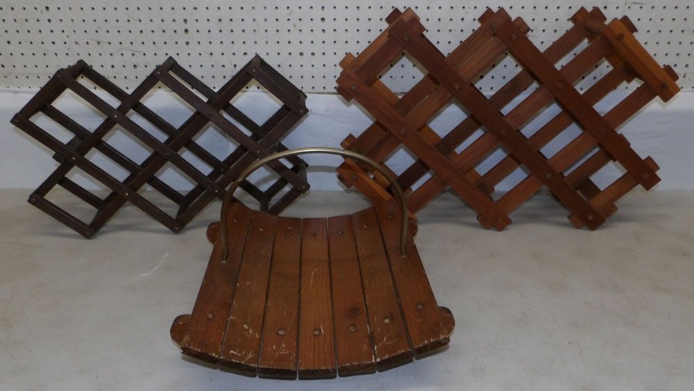 Two Wooden Wine Racks & Log Holder: Two Wooden Wine Racks & Log Holder. Up to 17 3/4" H 26 1/2" W 7" D ALL DESCRIPTIONS AND ANY CONDITION STATEMENT GIVEN BY LANGSTON AUCTION GALLERY ARE STRICTLY OPINIONS AND LANGSTON'S SHALL HAVE NO RES