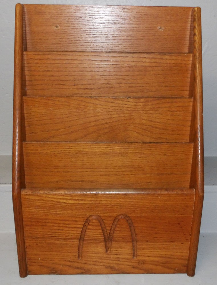 Oak McDonald's Magazine Stand: Oak McDonald's Magazine Stand . 24" H 16 1/2" W 7 1/4" D ALL DESCRIPTIONS AND ANY CONDITION STATEMENT GIVEN BY LANGSTON AUCTION GALLERY ARE STRICTLY OPINIONS AND LANGSTON'S SHALL HAVE NO RESPONSIBILIT