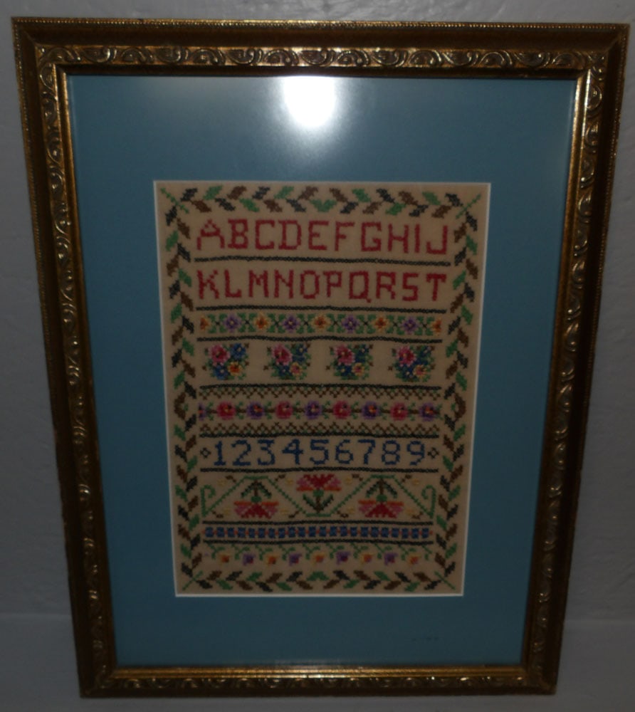 Framed Needlework Sampler: Framed Needlework Sampler. 18 1/4" x 14" ALL DESCRIPTIONS AND ANY CONDITION STATEMENT GIVEN BY LANGSTON AUCTION GALLERY ARE STRICTLY OPINIONS AND LANGSTON'S SHALL HAVE NO RESPONSIBILITY FOR ERRORS OR 