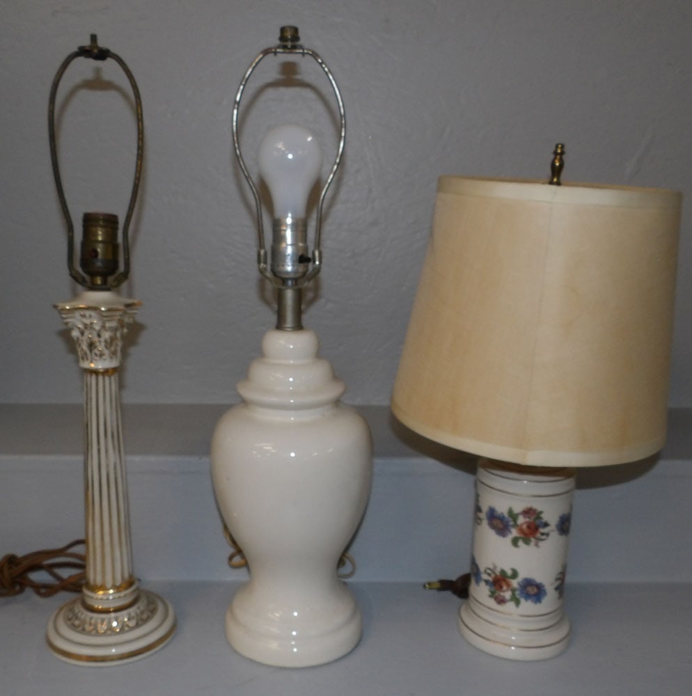 Three Porcelain Lamps: Three Porcelain Lamps . 22 3/4" H 5 1/2" Dia. ALL DESCRIPTIONS AND ANY CONDITION STATEMENT GIVEN BY LANGSTON AUCTION GALLERY ARE STRICTLY OPINIONS AND LANGSTON'S SHALL HAVE NO RESPONSIBILITY FOR ERROR