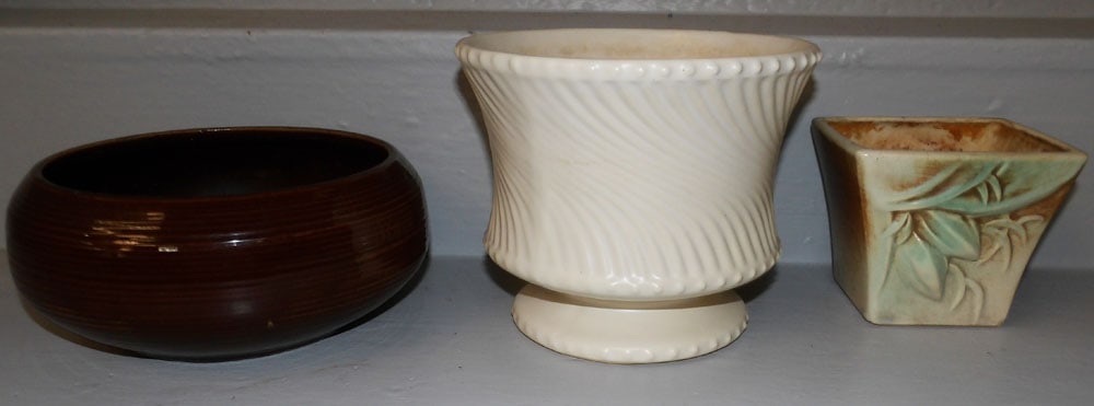 Three Pieces of McCoy Pottery: Three Pieces of McCoy Pottery. Up to 6" H 7 1/4" Dia. ALL DESCRIPTIONS AND ANY CONDITION STATEMENT GIVEN BY LANGSTON AUCTION GALLERY ARE STRICTLY OPINIONS AND LANGSTON'S SHALL HAVE NO RESPONSIBILITY F