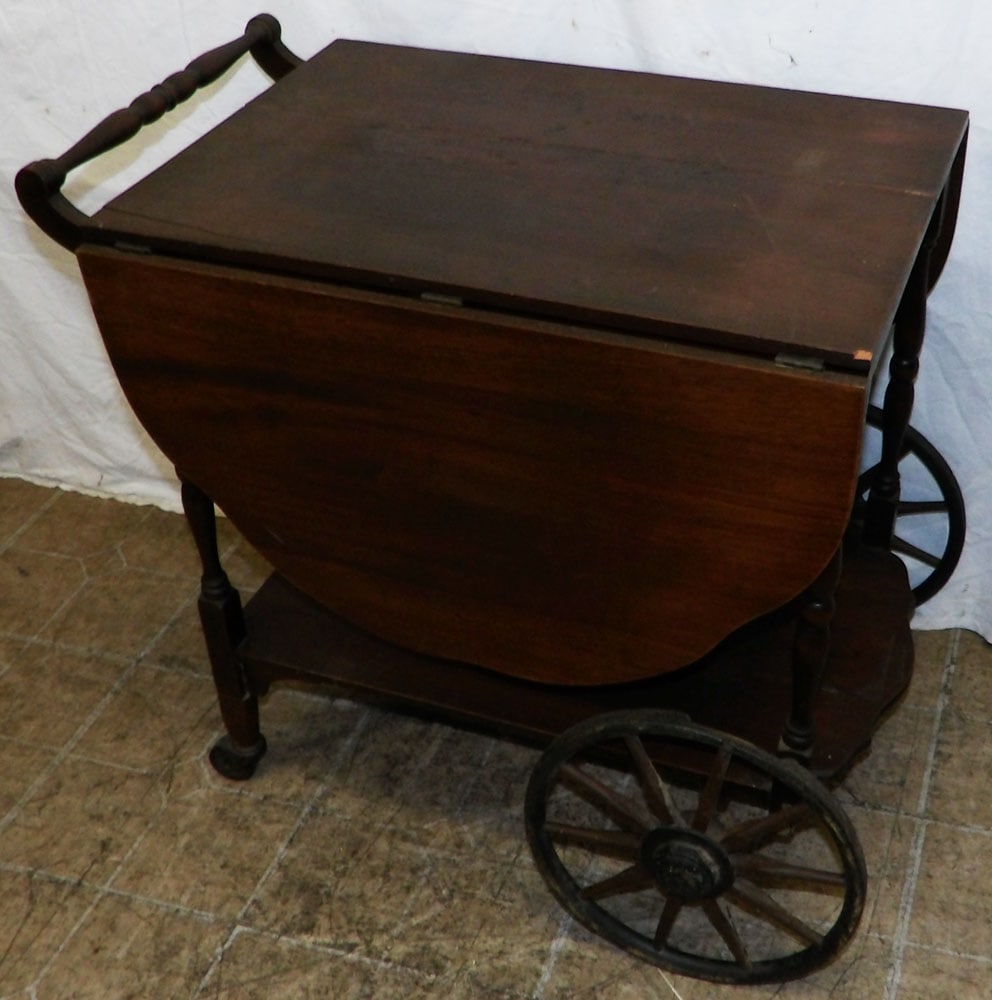 Antique Mahogany Tea Cart: Antique Mahogany Tea Cart . 28" H 28" W 21" D ALL DESCRIPTIONS AND ANY CONDITION STATEMENT GIVEN BY LANGSTON AUCTION GALLERY ARE STRICTLY OPINIONS AND LANGSTON'S SHALL HAVE NO RESPONSIBILITY FOR ERROR