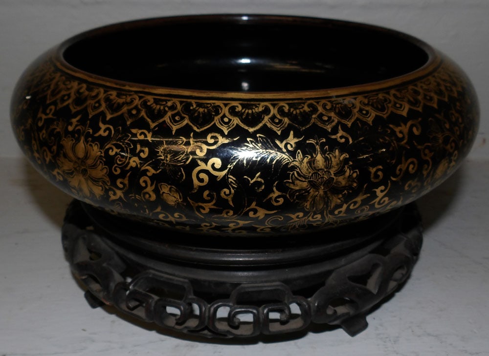 Antique Chinese Black & Gold Decorated Bowl on Teak Wood Stand: Antique Chinese Black & Gold Decorated Bowl on Teak Wood Stand . 5 1/4" H 9 3/4" Dia. ALL DESCRIPTIONS AND ANY CONDITION STATEMENT GIVEN BY LANGSTON AUCTION GALLERY ARE STRICTLY OPINIONS AND LANGSTON'
