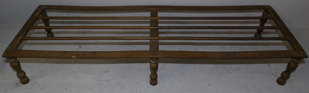 Antique Brass Trivet: Antique Brass Trivet. 5" H 30 1/2" W 10" D ALL DESCRIPTIONS AND ANY CONDITION STATEMENT GIVEN BY LANGSTON AUCTION GALLERY ARE STRICTLY OPINIONS AND LANGSTON'S SHALL HAVE NO RESPONSIBILITY FOR ERRORS O