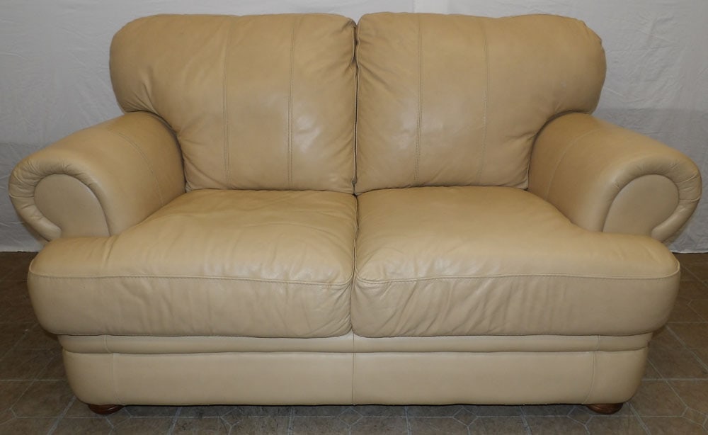 Leather Upholstered Loveseat: Leather Upholstered Loveseat. 38 1/4" H 67" W 39" D ALL DESCRIPTIONS AND ANY CONDITION STATEMENT GIVEN BY LANGSTON AUCTION GALLERY ARE STRICTLY OPINIONS AND LANGSTON'S SHALL HAVE NO RESPONSIBILITY FOR