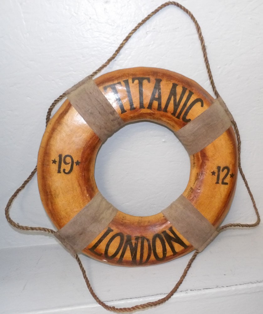 decorative life preserver: decorative life preserver. 19" Dia. ALL DESCRIPTIONS AND ANY CONDITION STATEMENT GIVEN BY LANGSTON AUCTION GALLERY ARE STRICTLY OPINIONS AND LANGSTON'S SHALL HAVE NO RESPONSIBILITY FOR ERRORS OR OMISS