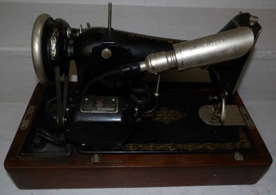 vintage singer sewing machine in walnut case