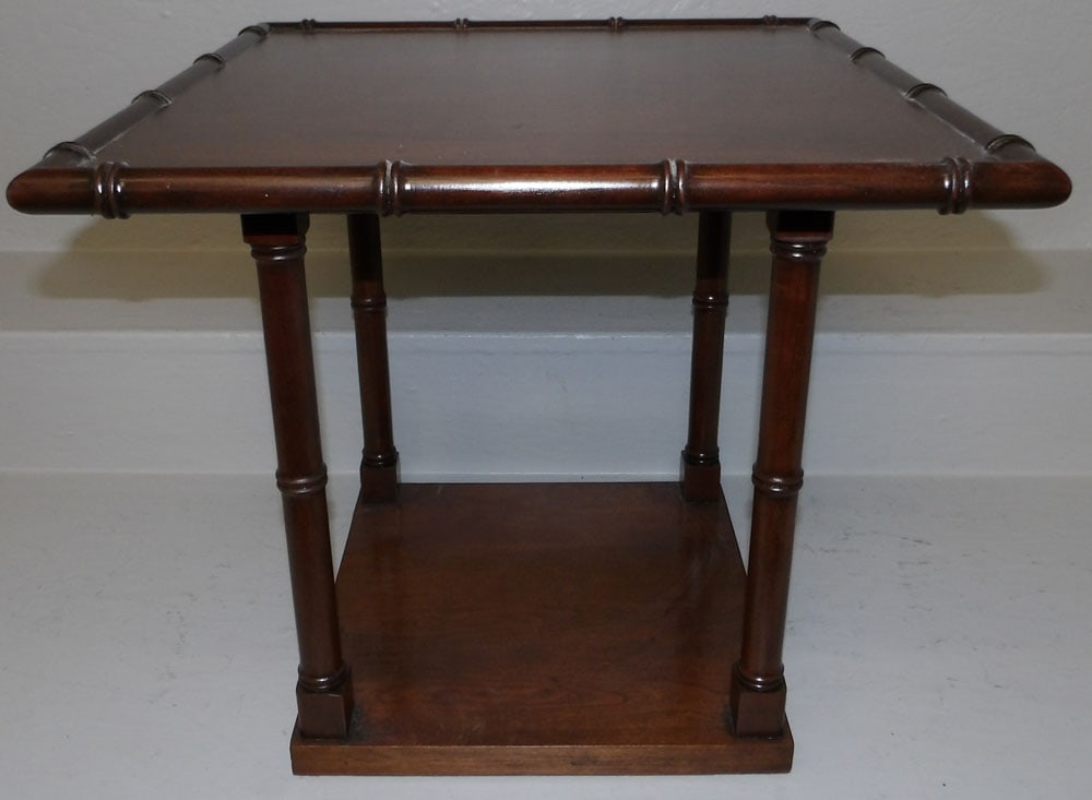 cherry faux bamboo stand: cherry faux bamboo stand . 17 1/4 H 19" Dia. ALL DESCRIPTIONS AND ANY CONDITION STATEMENT GIVEN BY LANGSTON AUCTION GALLERY ARE STRICTLY OPINIONS AND LANGSTON'S SHALL HAVE NO RESPONSIBILITY FOR ERRORS