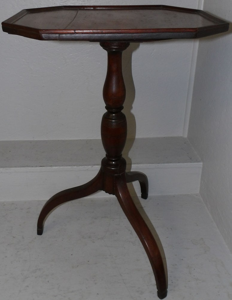 19th century mahogany tilt top candle stand: 19th century mahogany tilt top candle stand . 29" H 20" W 15 1/4" D ALL DESCRIPTIONS AND ANY CONDITION STATEMENT GIVEN BY LANGSTON AUCTION GALLERY ARE STRICTLY OPINIONS AND LANGSTON'S SHALL HAVE NO RE