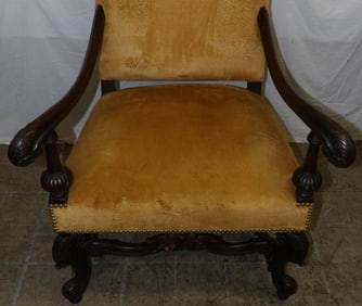 antique carved walnut and upholstered stretcher base library chair