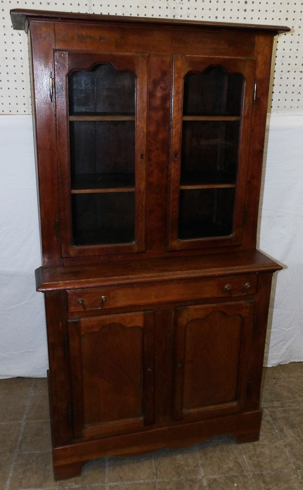 antique walnut and glass door cabinet: antique walnut and glass door cabinet . 52 1/4H 29W 16 3/4 D ALL DESCRIPTIONS AND ANY CONDITION STATEMENT GIVEN BY LANGSTON AUCTION GALLERY ARE STRICTLY OPINIONS AND LANGSTON'S SHALL HAVE NO RESPONSIB