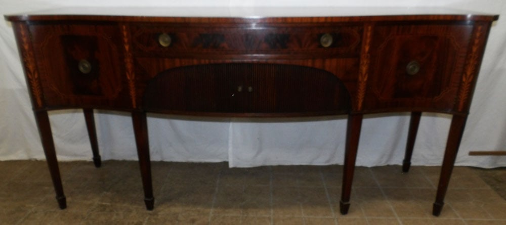 mahogany inlay serpentine front sideboard by Sloane: mahogany inlay serpentine front sideboard by Sloane. 36 3/4" H 79" W 24 1/2" D ALL DESCRIPTIONS AND ANY CONDITION STATEMENT GIVEN BY LANGSTON AUCTION GALLERY ARE STRICTLY OPINIONS AND LANGSTON'S SHALL
