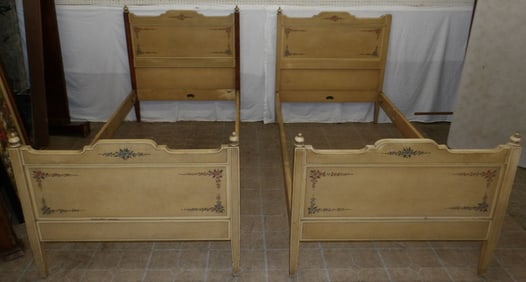 pair of hand painted wood twin beds labeled Ebbecke furniture company with rails