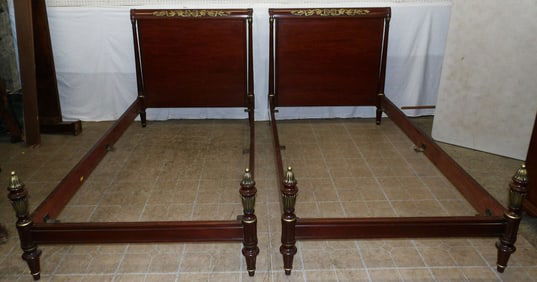 pair of mahogany and gilded paint decorated twin beds with rails