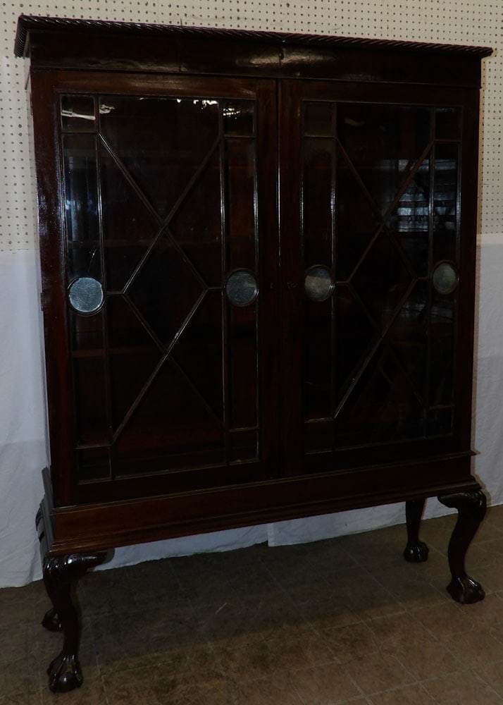19th century mahogany glass door bookcase with ball and claw feet: 19th century mahogany glass door bookcase with ball and claw feet . 64 3/4 H 50 W 14D ALL DESCRIPTIONS AND ANY CONDITION STATEMENT GIVEN BY LANGSTON AUCTION GALLERY ARE STRICTLY OPINIONS AND LANGSTON'