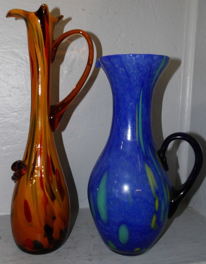 two art glass ewers one labeled Murano: two art glass ewers one labeled Murano . up to 16 1/4 by 6 D ALL DESCRIPTIONS AND ANY CONDITION STATEMENT GIVEN BY LANGSTON AUCTION GALLERY ARE STRICTLY OPINIONS AND LANGSTON'S SHALL HAVE NO RESPONSIB