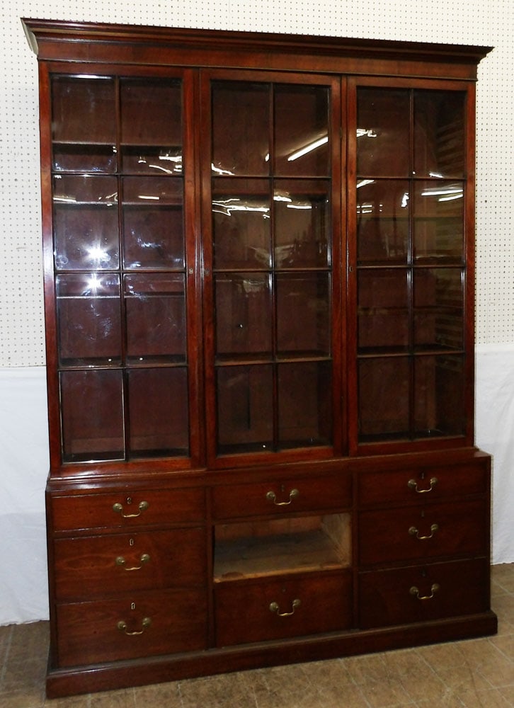 19th century mahogany two piece three glass door breakfront with one drawer missing: 19th century mahogany two piece three glass door breakfront with one drawer missing . 91 1/4" H 69" W 17" D ALL DESCRIPTIONS AND ANY CONDITION STATEMENT GIVEN BY LANGSTON AUCTION GALLERY ARE STRICTLY 