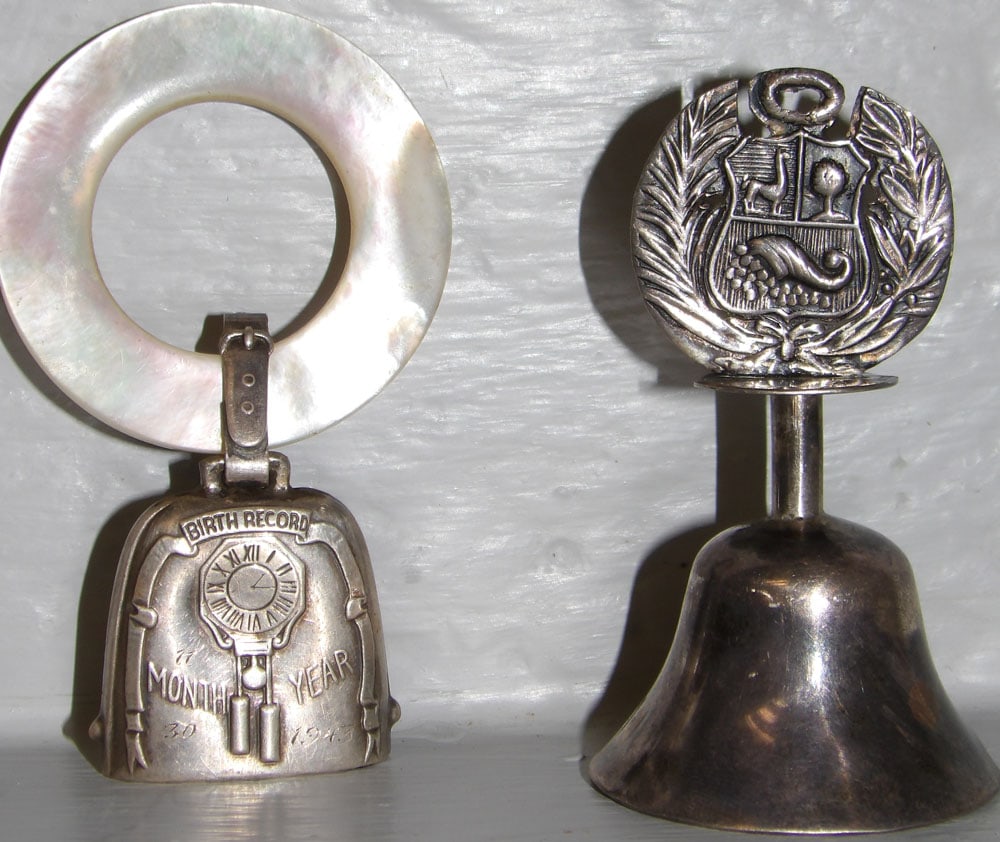 Sterling Mother of Pearl Baby Teething Rattle & Sterling Peruvian Bell: Sterling Mother of Pearl Baby Teething Rattle & Sterling Peruvian Bell . ALL DESCRIPTIONS AND ANY CONDITION STATEMENT GIVEN BY LANGSTON AUCTION GALLERY ARE STRICTLY OPINIONS AND LANGSTON'S SHALL HAVE