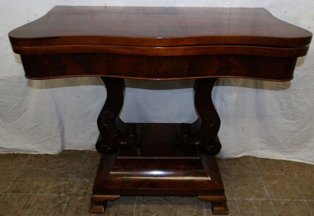 19th Century Mahogany Fold Over Top Game Table: 19th Century Mahogany Fold Over Top Game Table. 30 1/4" H 34" W 17" D ALL DESCRIPTIONS AND ANY CONDITION STATEMENT GIVEN BY LANGSTON AUCTION GALLERY ARE STRICTLY OPINIONS AND LANGSTON'S SHALL HAVE NO 