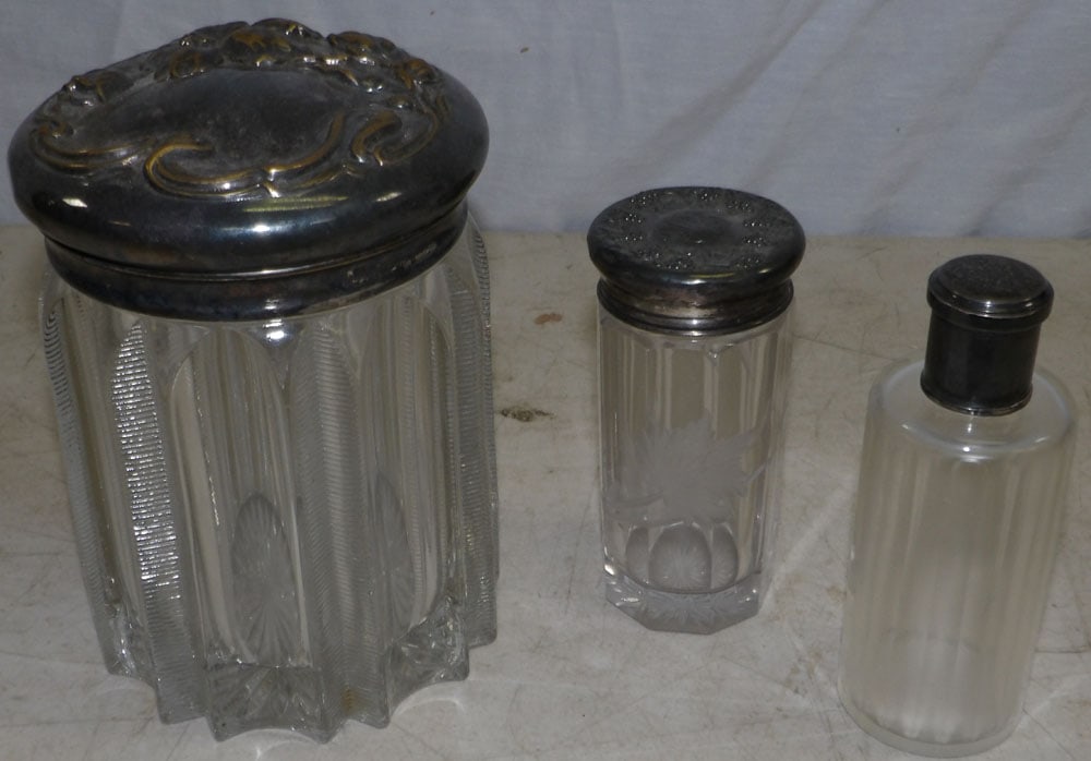 Lot of Glass Dresser Jars with Silverplated Lids: Lot of Glass Dresser Jars with Silverplated Lids. Up to 6" H 5" Dia. ALL DESCRIPTIONS AND ANY CONDITION STATEMENT GIVEN BY LANGSTON AUCTION GALLERY ARE STRICTLY OPINIONS AND LANGSTON'S SHALL HAVE NO R