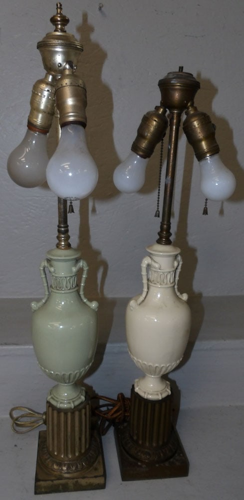 pair of painted porcelain and gilded metal lamps: pair of painted porcelain and gilded metal lamps. 26 1/2" H 4" Dia. ALL DESCRIPTIONS AND ANY CONDITION STATEMENT GIVEN BY LANGSTON AUCTION GALLERY ARE STRICTLY OPINIONS AND LANGSTON'S SHALL HAVE NO RE