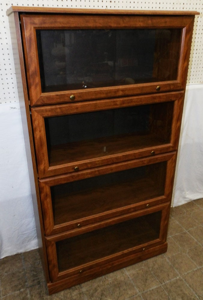 modern glass four door bookcase: modern glass four door bookcase . Up to 60 1/2" H 33 1/2" W 13" D ALL DESCRIPTIONS AND ANY CONDITION STATEMENT GIVEN BY LANGSTON AUCTION GALLERY ARE STRICTLY OPINIONS AND LANGSTON'S SHALL HAVE NO RESP