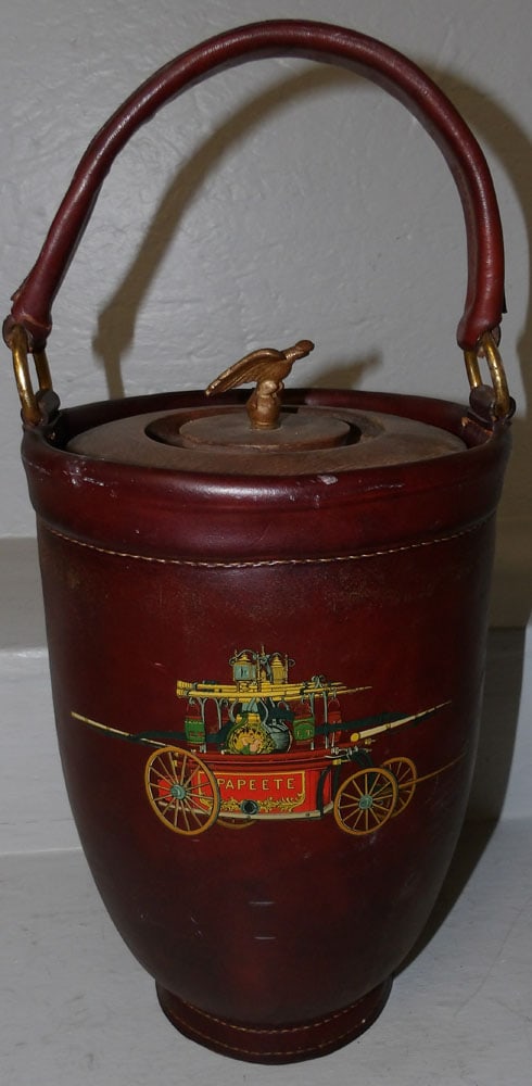 Leather Ice Bucket: Leather Ice Bucket . 18" H 8 1/2" Dia. ALL DESCRIPTIONS AND ANY CONDITION STATEMENT GIVEN BY LANGSTON AUCTION GALLERY ARE STRICTLY OPINIONS AND LANGSTON'S SHALL HAVE NO RESPONSIBILITY FOR ERRORS OR OM