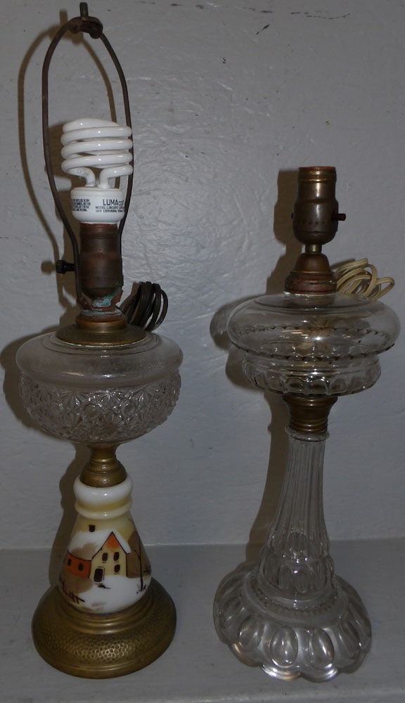 2 antique glass oil lamps electrified: 2 antique glass oil lamps electrified . Up to 21 1/2" H 6" Dia. ALL DESCRIPTIONS AND ANY CONDITION STATEMENT GIVEN BY LANGSTON AUCTION GALLERY ARE STRICTLY OPINIONS AND LANGSTON'S SHALL HAVE NO RESPON