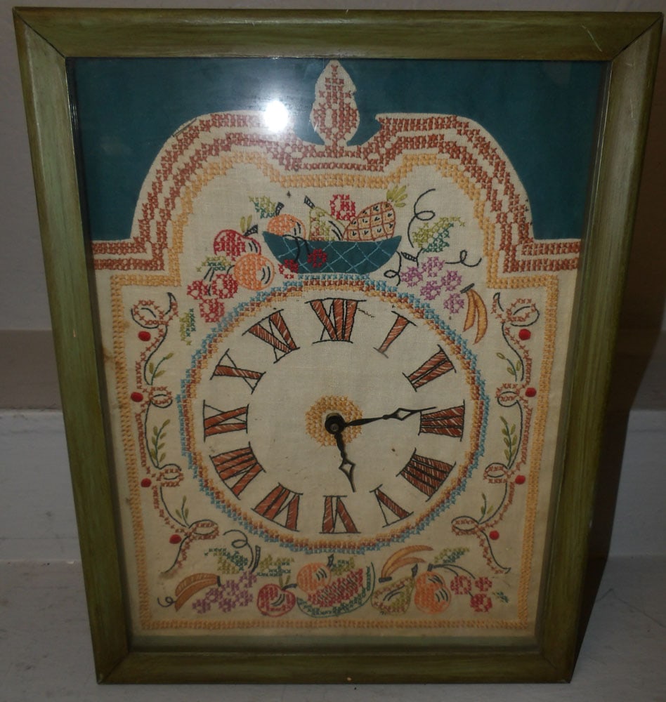 needlepoint dial wall clock: needlepoint dial wall clock . 17 1/2" x 13 1/2" ALL DESCRIPTIONS AND ANY CONDITION STATEMENT GIVEN BY LANGSTON AUCTION GALLERY ARE STRICTLY OPINIONS AND LANGSTON'S SHALL HAVE NO RESPONSIBILITY FOR ERR