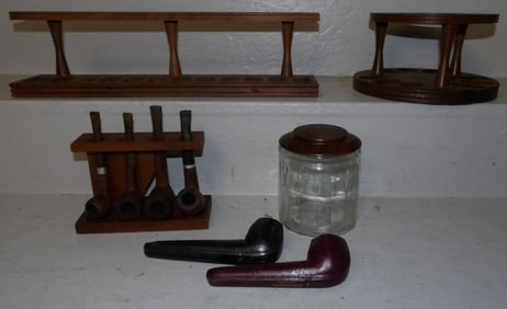 lot of pipes and walnut pipe stands