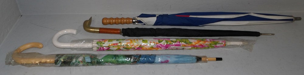 Lot of Umbrellas, (One with Brass Duck Head Handle): Lot of Umbrellas, (One with Brass Duck Head Handle). Up to 35" L ALL DESCRIPTIONS AND ANY CONDITION STATEMENT GIVEN BY LANGSTON AUCTION GALLERY ARE STRICTLY OPINIONS AND LANGSTON'S SHALL HAVE NO RESPO