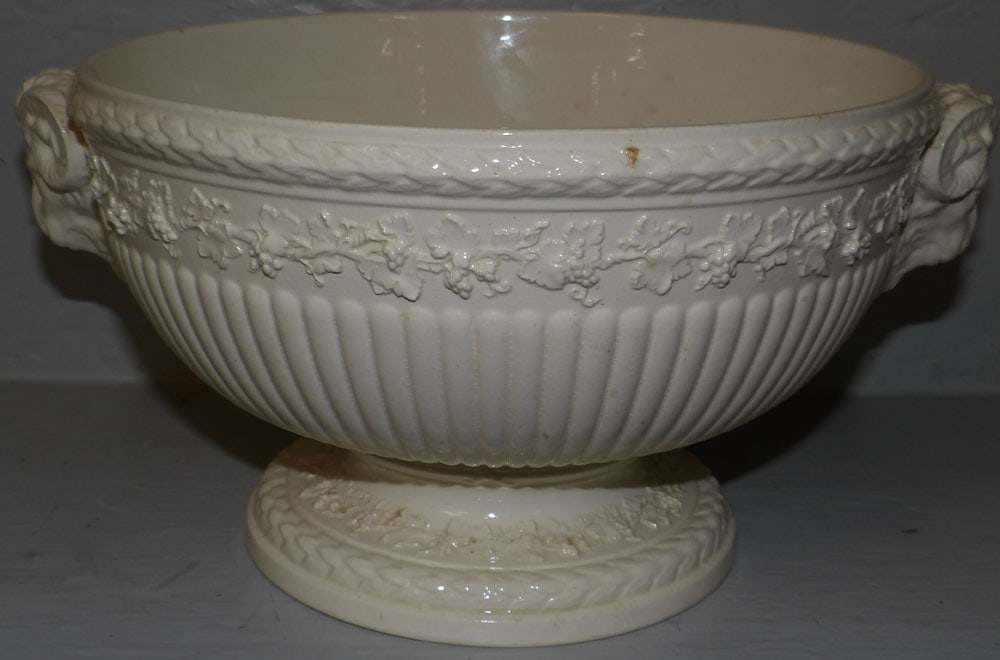 Cream Ware Wedgwood Pedestal Bowl with Ram's Head Motif: Cream Ware Wedgwood Pedestal Bowl with Ram's Head Motif . 6" H 11 1/2" W 9 1/2" D