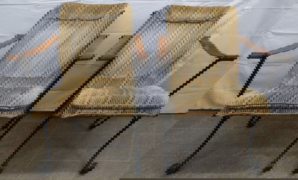 Pair of Mid Century Modern Wrought Iron & Leather Strap Arm Chairs by Woodard: Pair of Mid Century Modern Wrought Iron & Leather Strap Arm Chairs by Woodard. 34" H 26" W 26" Dia.