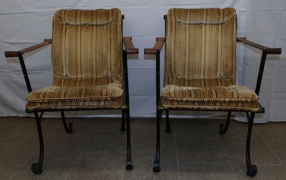 Pair of Mid Century Modern Wrought Iron & Leather Strap Arm Chairs by Woodard: Pair of Mid Century Modern Wrought Iron & Leather Strap Arm Chairs by Woodard. 34" H 26" W 26" Dia.