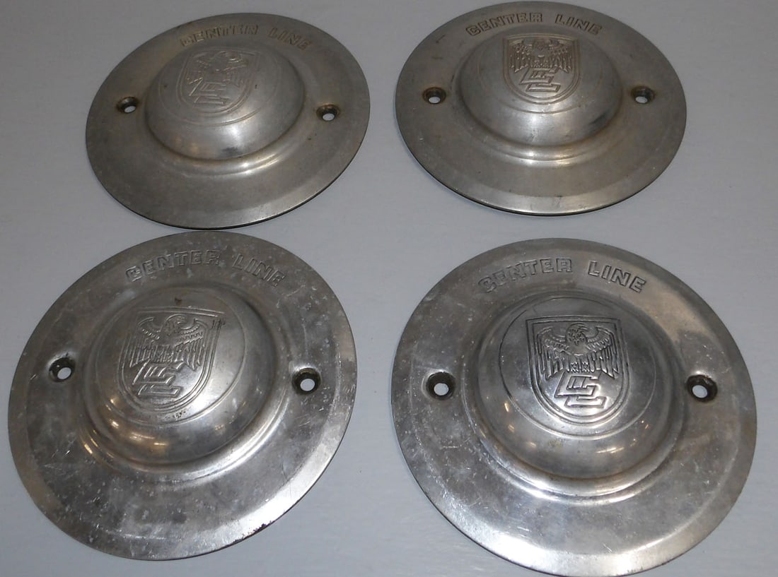 Set Four Center Line Aluminum Wheel Caps: Set Four Center Line Aluminum Wheel Caps. 7" Dia. ALL DESCRIPTIONS AND ANY CONDITION STATEMENT GIVEN BY LANGSTON AUCTION GALLERY ARE STRICTLY OPINIONS AND LANGSTON'S SHALL HAVE NO RESPONSIBILITY FOR E