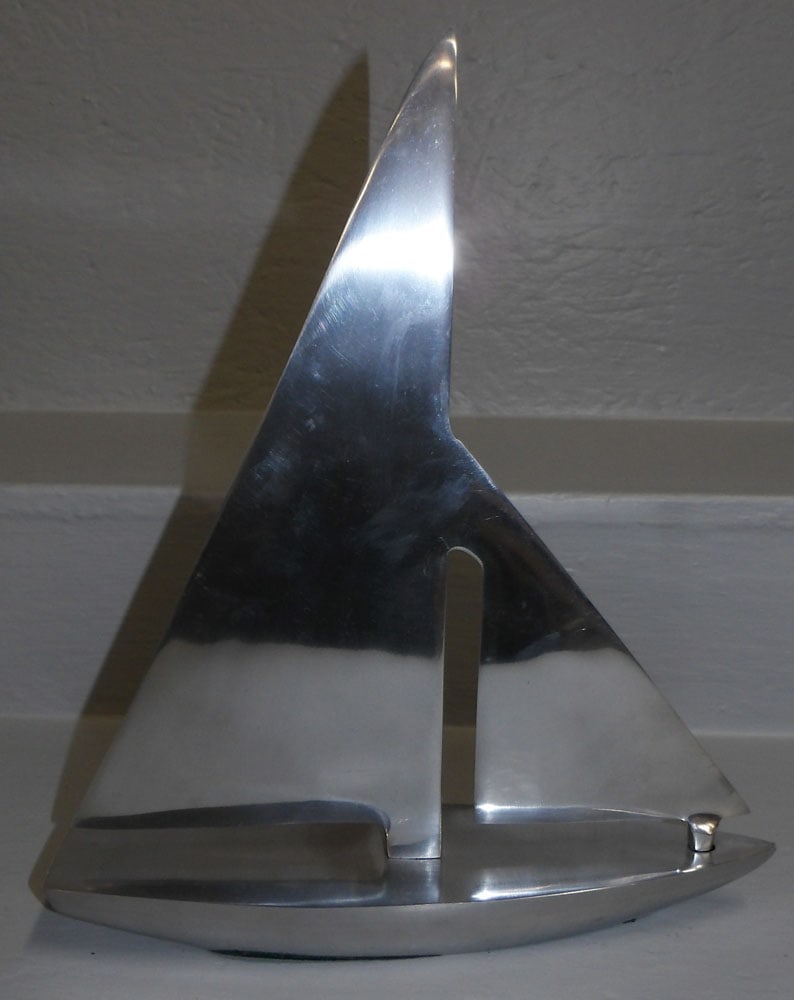 Mid Century Modern Cast Aluminum Sail Boat: Mid Century Modern Cast Aluminum Sail Boat. 14 1/2" H 13" W ALL DESCRIPTIONS AND ANY CONDITION STATEMENT GIVEN BY LANGSTON AUCTION GALLERY ARE STRICTLY OPINIONS AND LANGSTON'S SHALL HAVE NO RESPONSIBI