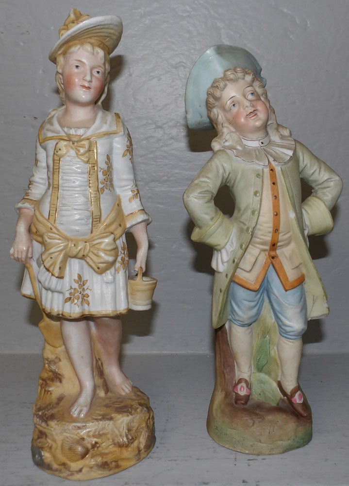 Pair of Bisque Figurines: Pair of Bisque Figurines . 12 1/4" H 4" Dia. ALL DESCRIPTIONS AND ANY CONDITION STATEMENT GIVEN BY LANGSTON AUCTION GALLERY ARE STRICTLY OPINIONS AND LANGSTON'S SHALL HAVE NO RESPONSIBILITY FOR ERRORS
