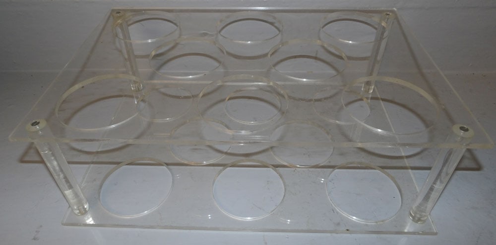 Mid Century Modern Acrylic Wine Rack: Mid Century Modern Acrylic Wine Rack. 18" H 11 3/4" W 5 3/4" D ALL DESCRIPTIONS AND ANY CONDITION STATEMENT GIVEN BY LANGSTON AUCTION GALLERY ARE STRICTLY OPINIONS AND LANGSTON'S SHALL HAVE NO RESPONS