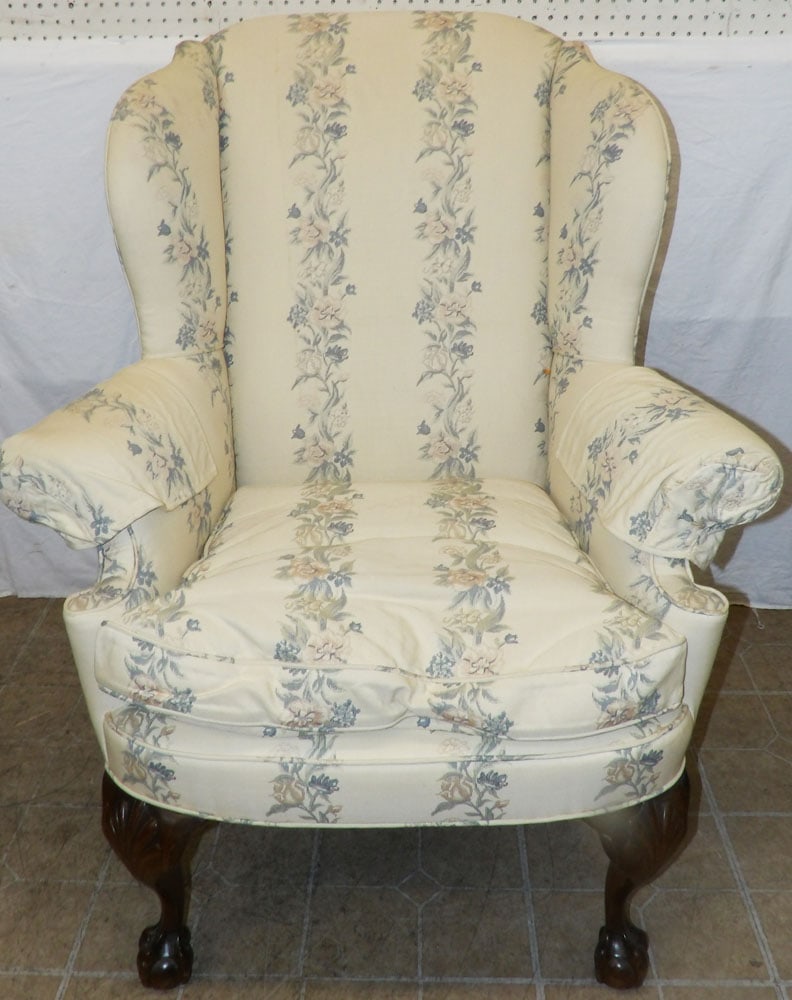 Carved Mahogany Upholstered Wing Back Chair: Carved Mahogany Upholstered Wing Back Chair . 44 1/4" H 37" W 30" D ALL DESCRIPTIONS AND ANY CONDITION STATEMENT GIVEN BY LANGSTON AUCTION GALLERY ARE STRICTLY OPINIONS AND LANGSTON'S SHALL HAVE NO RE