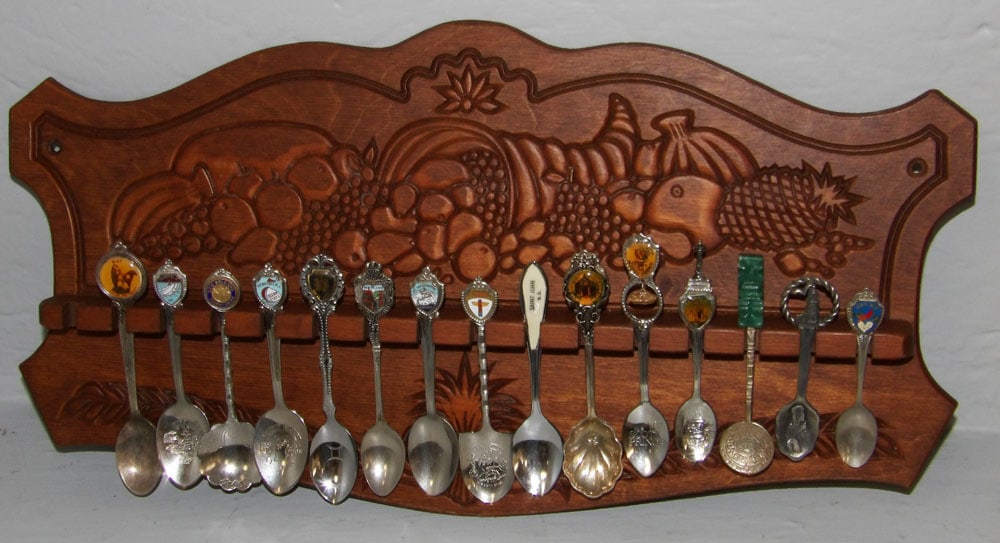 Ornate Wood Hanging Spoon Holder with Collection of Continental Souvenir Spoons: Ornate Wood Hanging Spoon Holder with Collection of Continental Souvenir Spoons. 9" x 17 1/2" ALL DESCRIPTIONS AND ANY CONDITION STATEMENT GIVEN BY LANGSTON AUCTION GALLERY ARE STRICTLY OPINIONS AND L