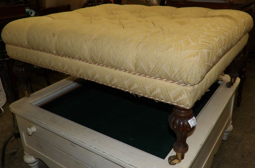 Walnut Upholstered Ottoman With Brass Castors: Walnut Upholstered Ottoman With Brass Castors. 17 3/4" H 42 1/2" W 33 1/2" D ALL DESCRIPTIONS AND ANY CONDITION STATEMENT GIVEN BY LANGSTON AUCTION GALLERY ARE STRICTLY OPINIONS AND LANGSTON'S SHALL H