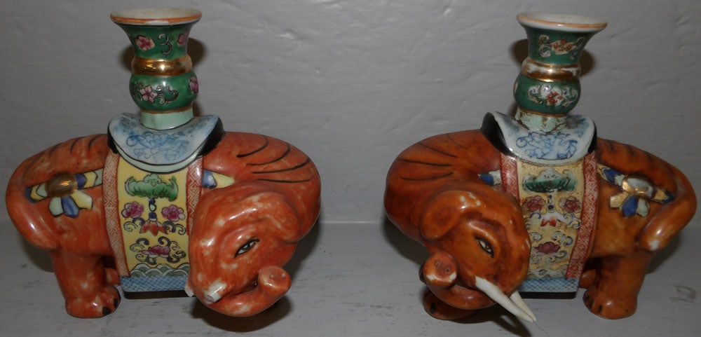 Pair of Painted Oriental Elephant Candlesticks ( One As Is): Pair of Painted Oriental Elephant Candlesticks ( One As Is). 7" H 7" W 4 1/2" D ALL DESCRIPTIONS AND ANY CONDITION STATEMENT GIVEN BY LANGSTON AUCTION GALLERY ARE STRICTLY OPINIONS AND LANGSTON'S SHAL