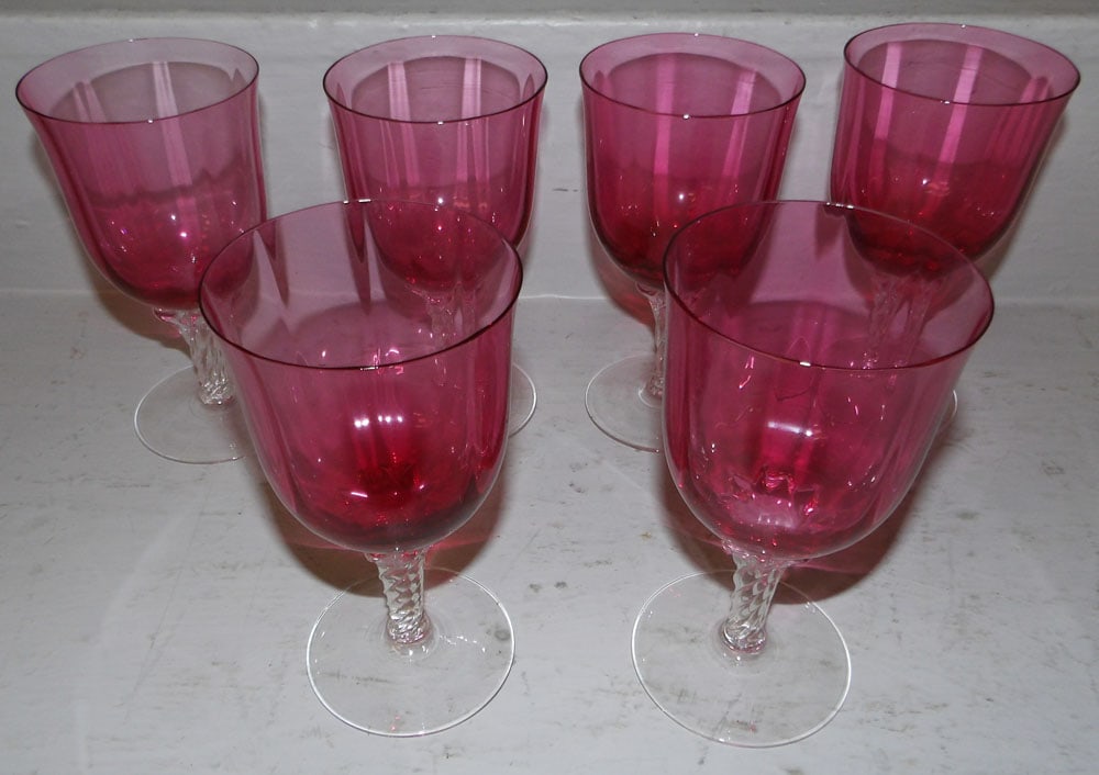 Six Cranberry Colored Wines: Six Cranberry Colored Wines. 6 1/2" H 3 1/2" Dia ALL DESCRIPTIONS AND ANY CONDITION STATEMENT GIVEN BY LANGSTON AUCTION GALLERY ARE STRICTLY OPINIONS AND LANGSTON'S SHALL HAVE NO RESPONSIBILITY FOR ER