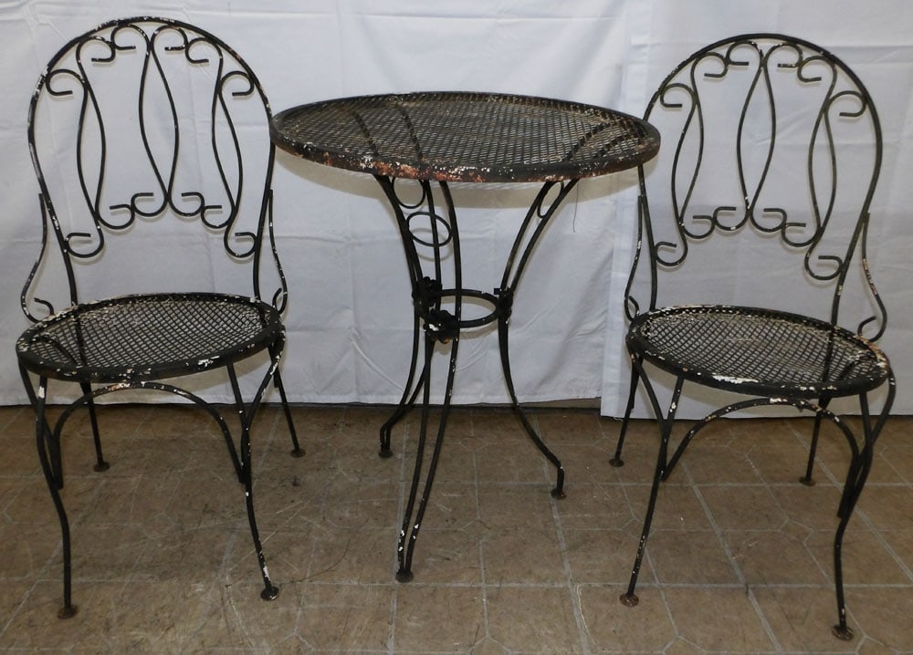Three Piece Wrought Iron & Mesh Table Set, Has Two Chairs: Three Piece Wrought Iron & Mesh Table Set, Has Two Chairs . Table - 29" H 24" Dia ALL DESCRIPTIONS AND ANY CONDITION STATEMENT GIVEN BY LANGSTON AUCTION GALLERY ARE STRICTLY OPINIONS AND LANGSTON'S SH