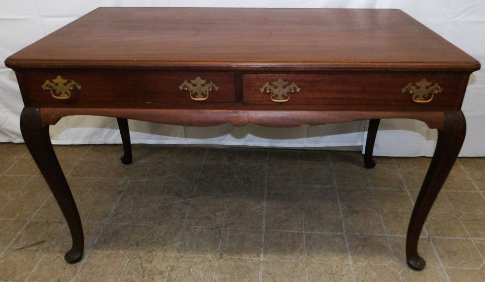 Mahogany Queen Anne Style Two Drawer Desk: Mahogany Queen Anne Style Two Drawer Desk. 28 1/4" H 48" W 28 1/2" D ALL DESCRIPTIONS AND ANY CONDITION STATEMENT GIVEN BY LANGSTON AUCTION GALLERY ARE STRICTLY OPINIONS AND LANGSTON'S SHALL HAVE NO R